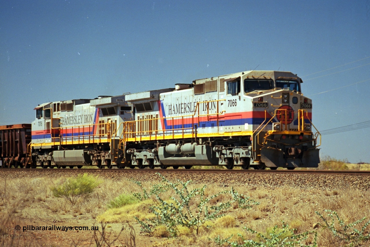 237-34
Dugite Siding, empty train in the passing track behind the standard pair of Hamersley Iron General Electric model Dash 9-44CW units 7066 serial 47745 and 7076 serial 47755. [url=https://goo.gl/maps/6og1H2khBAu] Geodata [/url].
Keywords: 7066;Dash-9-44CW;GE;47745;