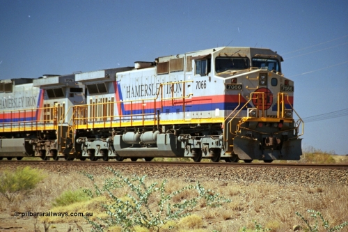 237-33
Dugite Siding, empty train in the passing track behind the standard pair of Hamersley Iron General Electric model Dash 9-44CW units 7066 serial 47745 and 7076. [url=https://goo.gl/maps/6og1H2khBAu] Geodata [/url].
Keywords: 7066;GE;Dash-9-44CW;47745;