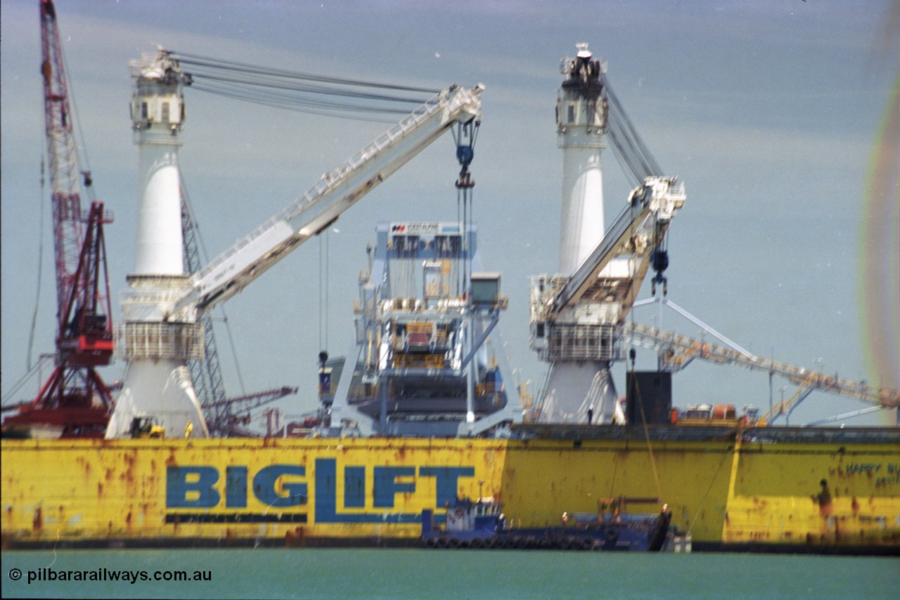 238-05
Port Hedland Harbour, heavy lift ship Happy Buccaneer (IMO: 8300389) sits at Finucane Island D Berth delivering a new shiploader for BHP Billiton. 1st November 2003. [url=https://goo.gl/maps/vWZoHTsRPsp] Geodata [/url]. Back in time here the ship cranes were only 550 tonne each, these are now 700.
Keywords: Happy-Buccaneer;Hitachi-Shipbuilding-Osaka-Japan;
