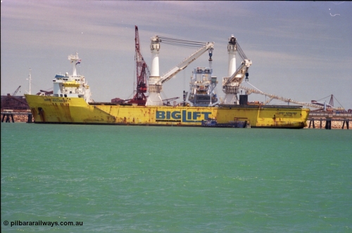 238-03
Port Hedland Harbour, heavy lift ship Happy Buccaneer (IMO: 8300389) sits at Finucane Island D Berth delivering a new shiploader for BHP Billiton. 1st November 2003. [url=https://goo.gl/maps/vWZoHTsRPsp] Geodata [/url]. Back in time here the ship cranes were only 550 tonne each, these are now 700.
Keywords: Happy-Buccaneer;Hitachi-Shipbuilding-Osaka-Japan;