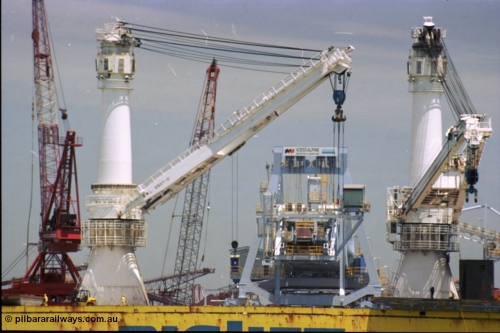 238-08
Port Hedland Harbour, heavy lift ship Happy Buccaneer (IMO: 8300389) sits at Finucane Island D Berth delivering a new shiploader for BHP Billiton. 1st November 2003. [url=https://goo.gl/maps/vWZoHTsRPsp] Geodata [/url]. Back in time here the ship cranes were only 550 tonne each, these are now 700.
Keywords: Happy-Buccaneer;Hitachi-Shipbuilding-Osaka-Japan;