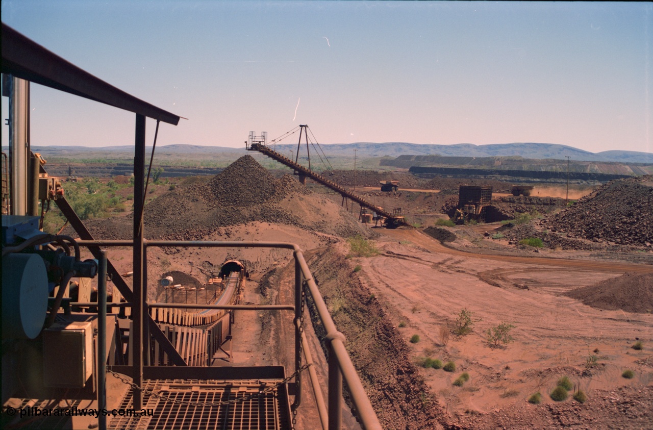 239-16
View of Yandi One OHP looking from the secondary crusher west back to the primary crusher system with CV3 and the reclaim tunnel and the pedestal mount for CV2 evident. The mine, trucks and waste dump can be seen in the background. [url=https://goo.gl/maps/gpgfApaAJYt]GeoData[/url].

