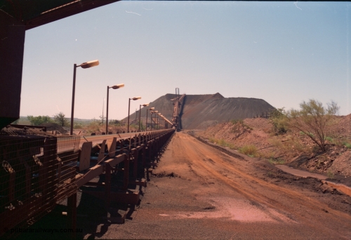 239-11
Overview of Yandi One looking towards the stockpile along CV11 towards CV20 and the radial stacker and CV21 the boom conveyor and full stockpile indicating the impending arrival of a train. The steel laydown is visible on the right. [url=https://goo.gl/maps/AL4aLqyaDJH2]GeoData[/url].
