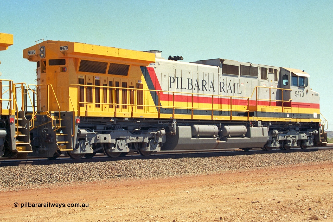 240-32
Seven Mile, trailing view of Pilbara Rail, Robe River owned, General Electric built Dash 9-44CW unit 9470 serial 53455. This and sister units 9471 and 9472 were the first painted in the Pilbara Rail livery. 31st August 2002.
Keywords: 9470;GE;Dash-9-44CW;53455;
