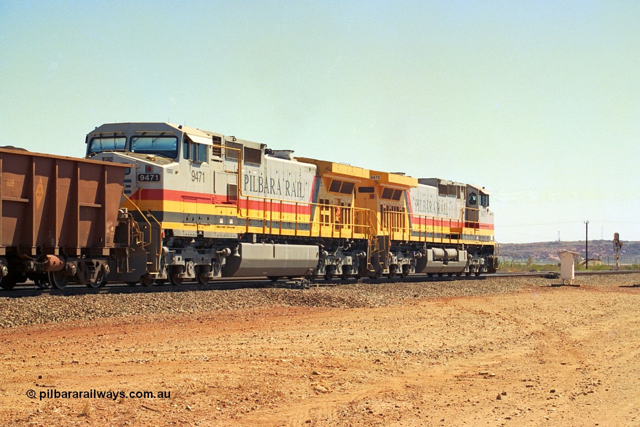 240-35
Seven Mile, trailing view of a loaded train heading for Parker Point behind a pair of Pilbara Rail, Robe River owned, General Electric built Dash 9-44CW units 9470 serial 53455 and 9471 serial 53456. These and sister unit 9472 were the first painted in the Pilbara Rail livery. 31st August 2002.
Keywords: 9470;9471;GE;Dash-9-44CW;53455;53456