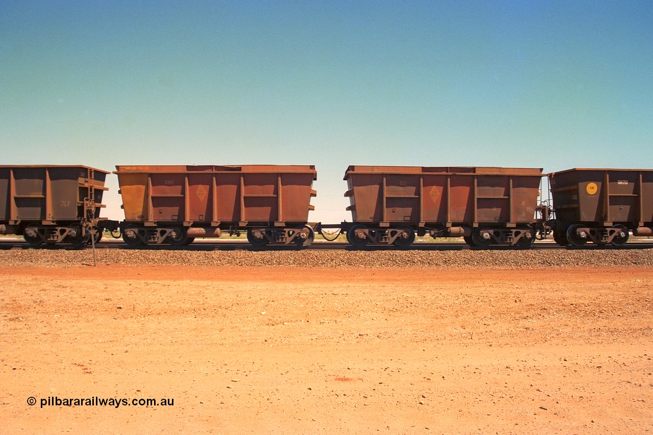 240-37
Seven Mile, a pair of loaded Nippon Sharyo ore waggons, control waggon 021 on the right with slave waggon 068 and with hungry boards fitted to the top. 31st August 2002.
Keywords: Nippon-Sharyo-Japan;