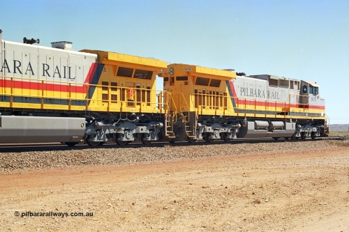 240-33
Seven Mile, trailing view of Pilbara Rail, Robe River owned, General Electric built Dash 9-44CW unit 9470 serial 53455. This and sister units 9471 and 9472 were the first painted in the Pilbara Rail livery. 31st August 2002.
Keywords: 9470;GE;Dash-9-44CW;53455;