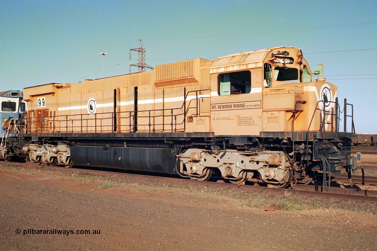 241-04
Nelson Point, Mt Newman Mining's last in-service ALCo M636 unit 5499 serial C6096-4 built by Comeng NSW sits awaiting partial dismantling before being sent by road to Rail Heritage WA's museum at Bassendean, Perth for preservation. June 2002.
Keywords: 5499;Comeng-NSW;ALCo;M636;C6096-4;