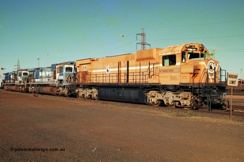 241-02
Nelson Point, Mt Newman Mining's last in-service ALCo M636 unit 5499 serial C6096-4 built by Comeng NSW sits awaiting partial dismantling before being sent by road to Rail Heritage WA's museum at Bassendean, Perth for preservation with two C36-7M units 5506 and 5510 also awaiting removal from site. June 2002.
Keywords: 5499;Comeng-NSW;MLW-ALCo;M636;C6096-4;