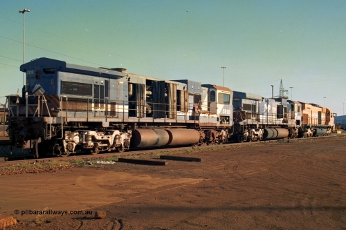 241-13
Nelson Point, Goninan GE rebuild C36-7M unit 5510 serial 4839-07 / 87-075 is in the process of being removed from site bound for Asset Kinetics in Maddington, Perth. This image shows the Dash 8 radiator frame fitted to it following collision repairs, sister unit 5506 and M636 unit 5499. June 2002.
Keywords: 5510;Goninan;GE;C36-7M;4839-07/87-075;rebuild;AE-Goodwin;ALCO;C636;5458;G6027-2;