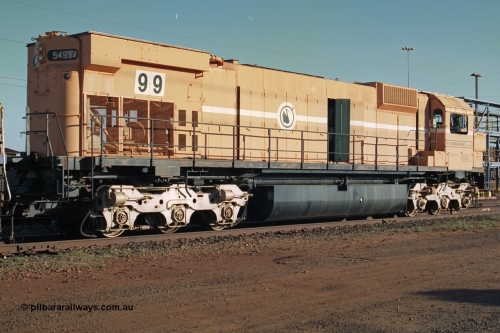 241-19
Nelson Point, Mt Newman Mining's last in-service ALCo M636 unit 5499 serial C6096-4 built by Comeng NSW sits awaiting partial dismantling before being sent by road to Rail Heritage WA's museum at Bassendean, Perth for preservation. Three quarter rear view. June 2002.
Keywords: 5499;Comeng-NSW;MLW-ALCo;M636;C6096-4;