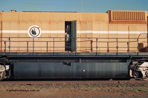 241-22
Nelson Point, Mt Newman Mining's last in-service ALCo M636 unit 5499 serial C6096-4 built by Comeng NSW sits awaiting partial dismantling before being sent by road to Rail Heritage WA's museum at Bassendean, Perth for preservation. Drivers side view of the engine hood and fuel tank. June 2002.
Keywords: 5499;Comeng-NSW;MLW-ALCo;M636;C6096-4;