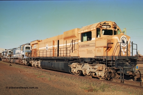 241-26
Nelson Point, Mt Newman Mining's last in-service ALCo M636 unit 5499 serial C6096-4 built by Comeng NSW sits awaiting partial dismantling before being sent by road to Rail Heritage WA's museum at Bassendean, Perth for preservation with two C36-7M units 5506 and 5510 also awaiting removal from site. June 2002.
Keywords: 5499;Comeng-NSW;MLW-ALCo;M636;C6096-4;