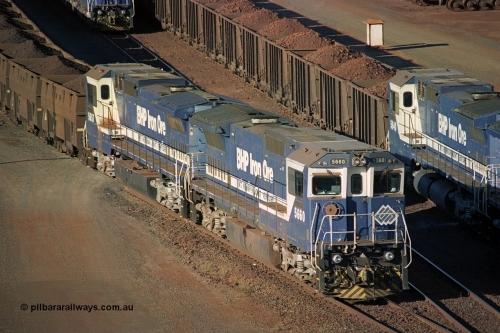 241-37
Nelson Point, Car Dumper 2 holding roads, two loaded ore rakes behind pairs of CM40-8M units on each wait their turn through the dumper to discharge as 5660 'Kure' serial 8412-05 / 94-151 and 5657 'Fukuyama' drag their loaded train towards the dumper to discharge . June 2002.
Keywords: 5660;Goninan;GE;CM40-8M;8412-05/94-151;rebuild;AE-Goodwin;ALCo;M636C;5478;G6047-10;