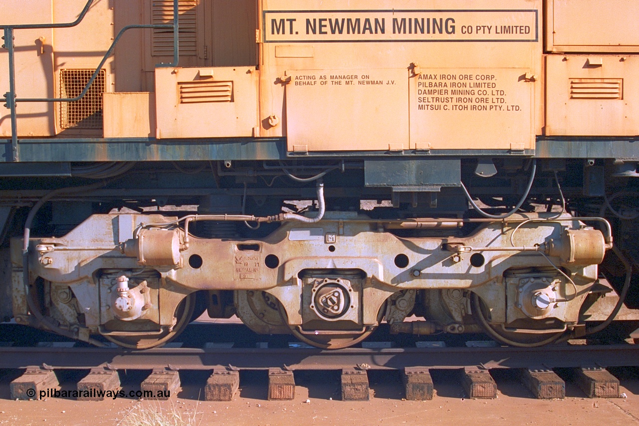 242-21
Port Hedland, Don Rhodes Mining Museum, preserved Mt Newman Mining Comeng NSW built ALCo M636 unit 5497 serial C6096-2, view of bogie. May 2002.
Keywords: 5497;Comeng-NSW;ALCo;M636;C6096-2;