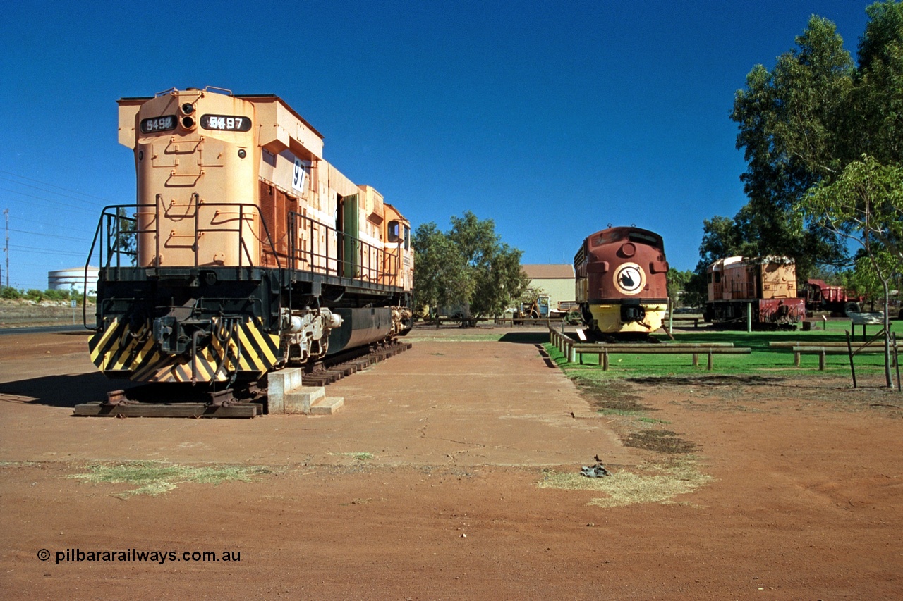 243-03
Port Hedland, Don Rhodes Mining Museum, preserved locomotives from the early days of the Port Hedland iron ore miners of Goldsworthy Mining and Mt Newman Mining. From left is Mt Newman Mining 5497, a Comeng NSW built M636 ALCo unit, Mt Newman Mining 5451 which was built by EMD as an F7A model and started life with Western Pacific in the USA and Goldsworthy Mining B class unit #2 built by English Electric serial number A-105. August 2003.
Keywords: 5497;Comeng-NSW;ALCo;M636;C6096-2;