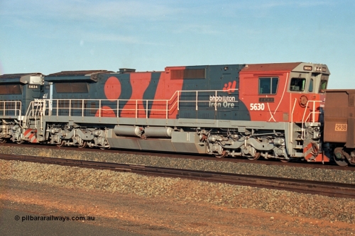 243-06
Nelson Point departure yard, BHP Billiton's CM39-8 unit 5630 'Zeus' serial 5831-09 / 88-079 and built new by Goninan trails CM40-8M unit 5634 both in the new 'earth' or 'bubble' livery as they head up an empty train waiting departure time. August 2003.
Keywords: 5630;Goninan;GE;CM39-8;5831-09/88-079;