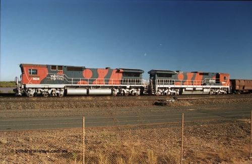 243-16
Nelson Point departure yard, BHP Billiton's CM40-8M unit 5634 'Boodarie' a Goninan WA GE rebuild unit serial 8151-07 / 91-120 in the new 'earth' or 'bubble' livery as it heads up an empty train waiting departure time. August 2003.
Keywords: 5634;Goninan;GE;CM40-8M;8151-07/91-120;rebuild;AE-Goodwin;ALCo;C636;5457;G6027-1;
