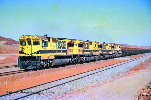 246-20
Cape Lambert, a Robe River loaded Deepdale train arrives on the main behind the standard quad Dash 8 power with 202 waggons. 9414 which is a Goninan WA ALCo to GE rebuild CM40-8M with serial 8206-11 / 91-124 from November 1991 riding on Dofasco bogies and was originally an AE Goodwin built M636 ALCo built new for Robe in December 1971 and numbered 262.005, later numbered 1714. 22nd May 2002.
Keywords: 9414;Goninan;GE;CM40-8M;8206-11/91-124;rebuild;AE-Goodwin;ALCo;M636;G6060-5;