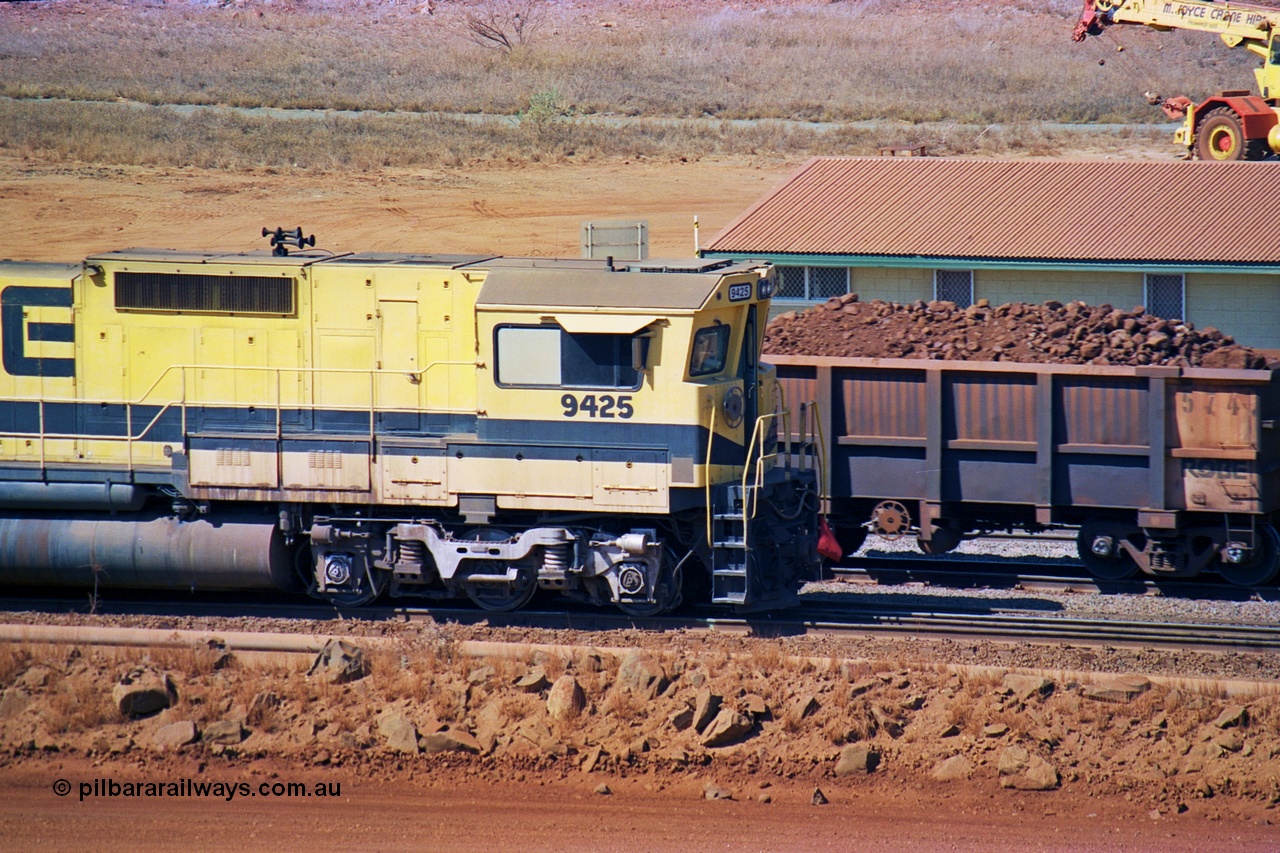 247-28
Cape Lambert fuel point, Robe River Dash 8 power 9425 which is a Goninan WA ALCo to GE rebuild CM40-8M with serial 6266-8 / 89-85 from August 1989 riding on Hi-Ad bogies and was originally an AE Goodwin built M636 ALCo serial C-6041-4 and built new for Mt Newman Mining (later BHP Iron Ore) in April 1970 and numbered 5468, sold to Robe and delivered by road 17th August 1982. Everything below the frame is ALCo while above is GE and Pilbara Cab. Approximate location of the locos is [url=https://goo.gl/maps/DEynwwkV9PZra5Gm7]here[/url]. 22nd May 2002.
Keywords: 9425;Goninan;GE;CM40-8M;6266-8/89-85;rebuild;AE-Goodwin;ALCo;M636;G-6041-4;