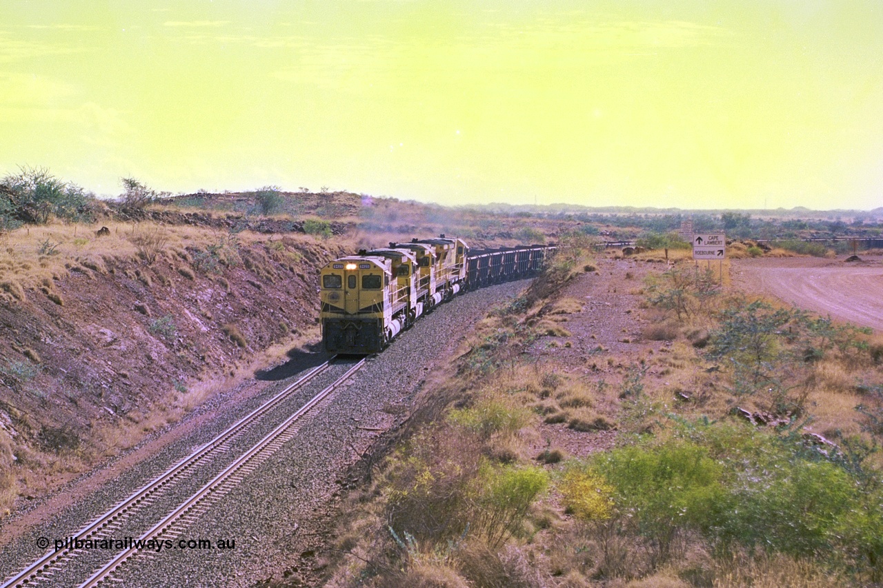 247-30
Near Cooya Pooya at the 37.5 km on the Robe River Cape Lambert line an empty train is about to pass under the town water supply pipeline and pass through Lockyer Gap behind the standard Robe power of quad CM40-8M or Dash 8. Location is [url=https://goo.gl/maps/nLyndU6bg2HA5SZX6]here[/url].22nd May 2002.
Keywords: 9425;Goninan;GE;CM40-8M;6266-8/89-85;rebuild;AE-Goodwin;ALCo;M636;G-6041-4;