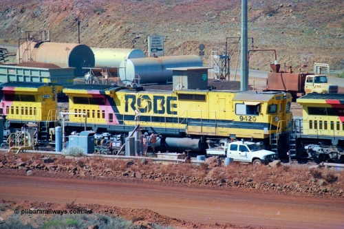 247-07
Cape Lambert fuel point, Robe River locomotive 9420 which is a Goninan WA ALCo to GE rebuild CM40-8M with serial 8109-03 / 91-119 from March 1991 riding on Hi-Ad bogies and was originally an ALCo Schenectady built C630 serial 3486-4 and built new for Chesapeake & Ohio (USA) as their 2103. It is one of four C630 ALCo units purchased in 1974 and delivered to Robe in January 1975. Everything below the frame is ALCo while above is GE and Pilbara Cab. Approximate location of the locos is [url=https://goo.gl/maps/DEynwwkV9PZra5Gm7]here[/url]. 22nd May 2002.
Keywords: 9420;Goninan;GE;CM40-8M;8109-03/91-119;rebuild;ALCo;C630;3486-4;C+O;2103;