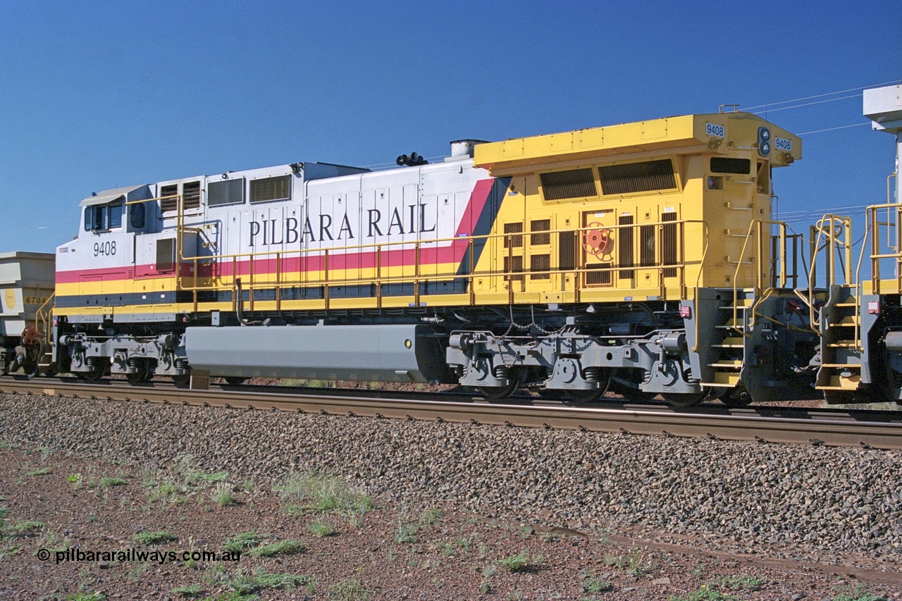 248-05
Dingo Siding on the Hamersley Iron railway at the 39 km with an empty train headed up by a pair of General Electric built Dash 9-44CW units 9408 serial 54158 from the fourth order in 2003 wearing the Pilbara Rail livery with Robe ownership markings. Approximate [url=https://goo.gl/maps/Jv752bD5KXv28oUV7]location[/url]. 24th April 2004.
Keywords: 9408;GE;Dash-9-44CW;54158;