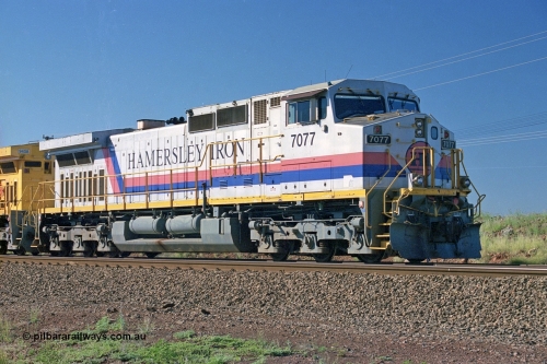 248-02
Dingo Siding on the Hamersley Iron railway at the 39 km with an empty train headed up by a pair of General Electric built Dash 9-44CW units 7077 serial 47756 from the original first order in the Pepsi Can livery from 1994 still looking good some ten years later. Approximate [url=https://goo.gl/maps/Jv752bD5KXv28oUV7]location[/url]. 24th April 2004.
Keywords: 7077;GE;Dash-9-44CW;47756;