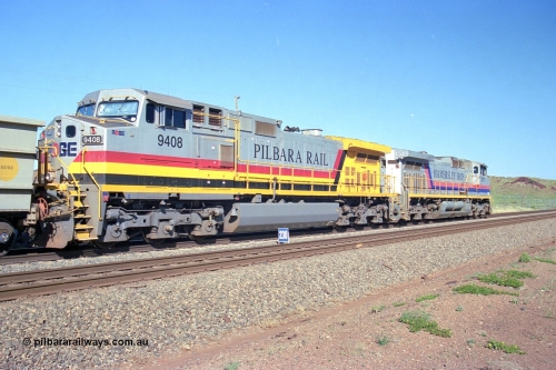 248-08
Dingo Siding on the Hamersley Iron railway at the 39 km with an empty train headed up by a pair of General Electric built Dash 9-44CW units 7077 serial 47756 from the original first order in the Pepsi Can livery and 9408 serial 54158 from the fourth order in the Pilbara Rail livery with Robe ownership markings. Approximate [url=https://goo.gl/maps/Jv752bD5KXv28oUV7]location[/url]. 24th April 2004.
Keywords: 9408;GE;Dash-9-44CW;54158;
