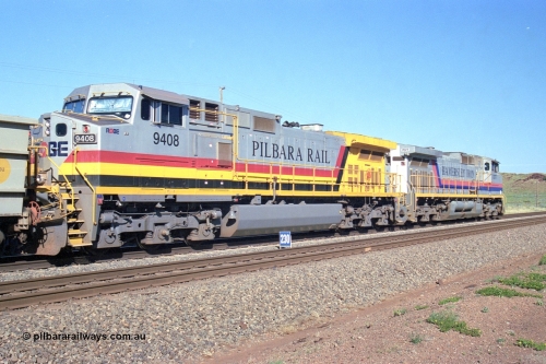 248-11
Dingo Siding on the Hamersley Iron railway at the 39 km with an empty train headed up by a pair of General Electric built Dash 9-44CW units 7077 serial 47756 from the original first order in the Pepsi Can livery and 9408 serial 54158 from the fourth order in the Pilbara Rail livery with Robe ownership markings. Approximate [url=https://goo.gl/maps/Jv752bD5KXv28oUV7]location[/url]. 24th April 2004.
Keywords: 9408;GE;Dash-9-44CW;54158;