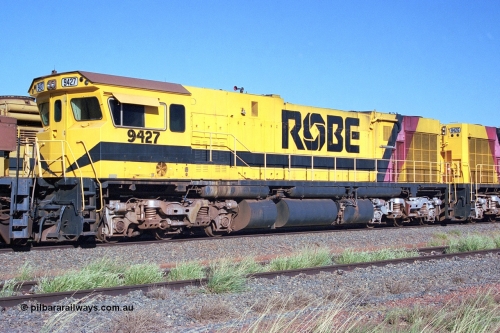 248-17
Seven Mile yard, stored Robe River ALCo locomotives at the south end of the Hamersley Iron Seven Mile yard on roads N2 and N3. On road N2 is 9427 a Comeng WA C636R rebuild from ALCo Schenectady NY model C636 serial 3499-2 originally built in January 1968 for Pennsylvania Railroad as #6331, Penn Central 6331 and finally Conrail 6781. Purchased in 1986 and rebuilt by Comeng WA into C636R before delivery to Robe in January 1987. This loco also went on to become DR 8403 for construction of FMG's railway in 2007-08. Approximate [url=https://goo.gl/maps/CXwAreRPb2RymQ9m9]location[/url]. 24th April 2004.
Keywords: 9427;Comeng-WA;C636R;WA143-2;rebuild;ALCo;Schenectady-NY;C636;Conrail;6781;3499-2;
