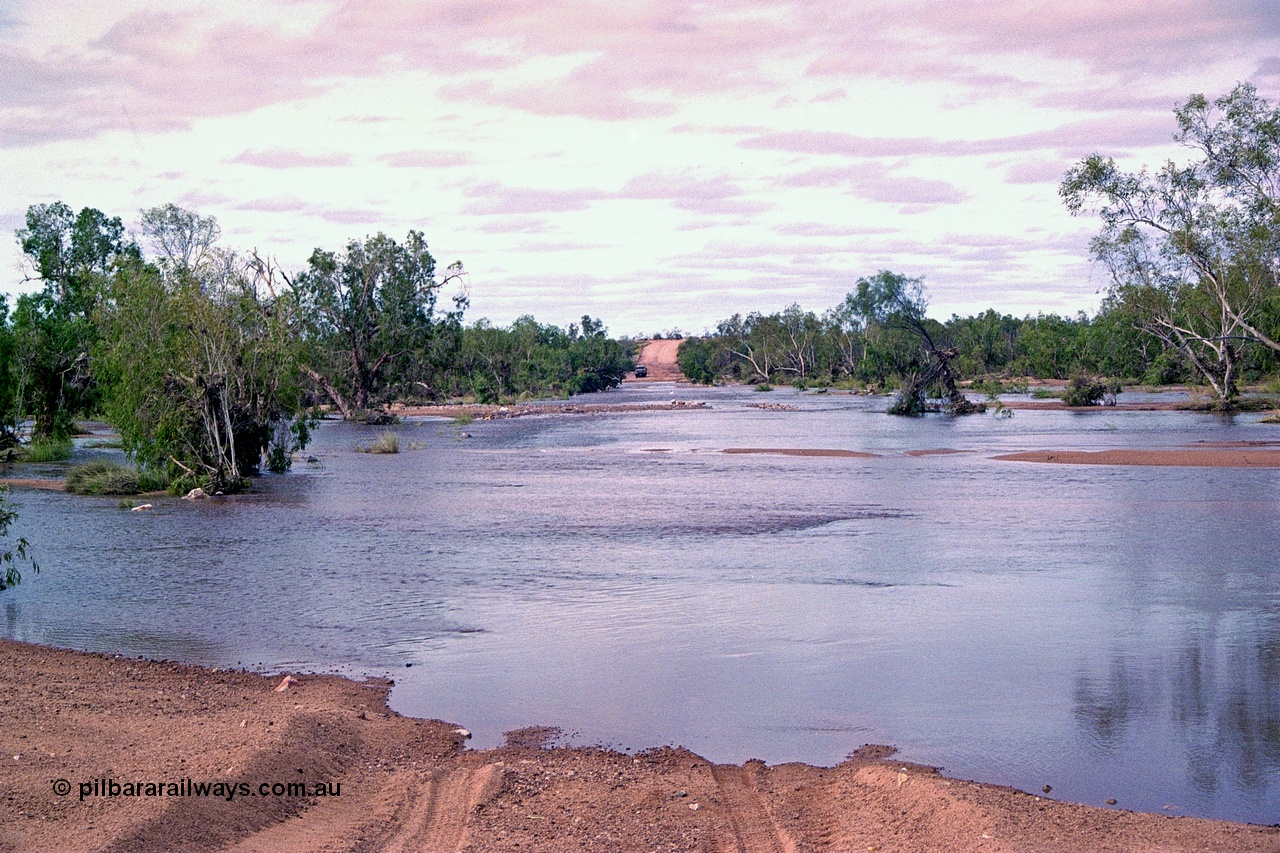 249-01
Yule River road crossing on the former Hedland - Wittenoom Road in flood after Tropical Cyclone John in December 1999. Approximate [url=https://goo.gl/maps/7rbsJE678d4i18MB9]location[/url].
