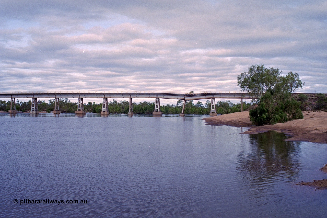 249-09
Yule River bridge looking east upstream the third pier from the southern end was undermined by flood waters from Tropical Cyclone John in December 1999. The rail line was closed for two weeks while repairs were effected. Approximate [url=https://goo.gl/maps/phCWr8u1xnuBdzwj6]location[/url].
