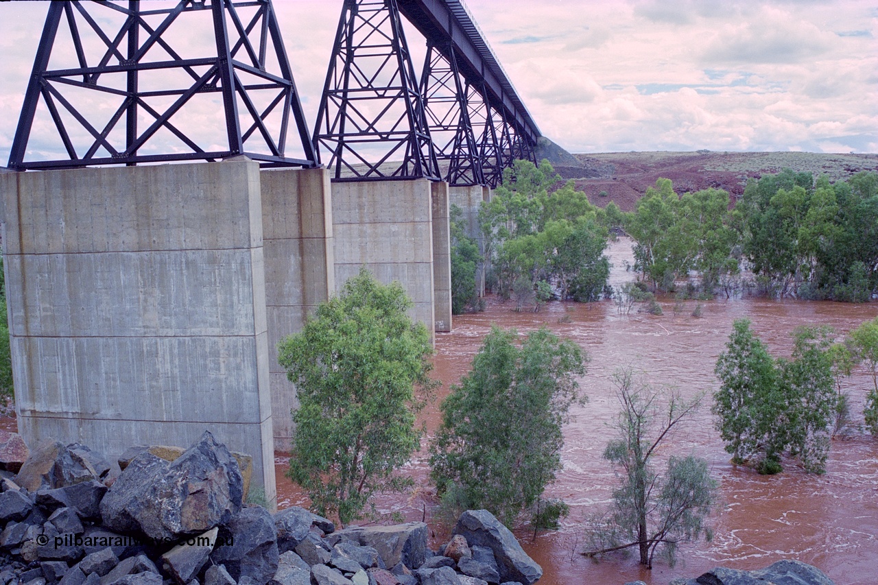249-20
Fortescue River Bridge on the Robe River line at the 115.8 km in flood looking south following Cyclone John on 18th December 1999. Approximate [url=https://goo.gl/maps/CDTmtMLJewGrMq699]location[/url].
