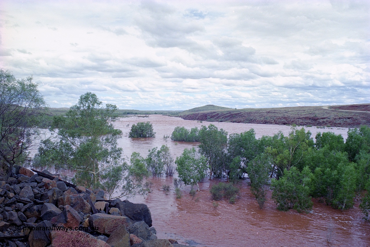 249-22
Fortescue River Bridge on the Robe River line at the 115.8 km in flood looking upstream following Cyclone John on 18th December 1999. Approximate [url=https://goo.gl/maps/3bQRYnLXf8JXCtvu7]location[/url].
