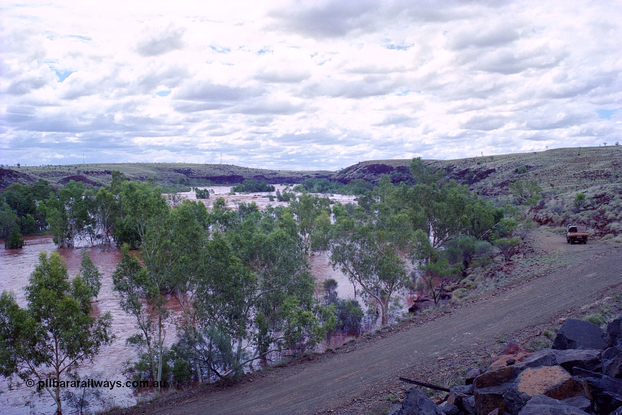 249-23
Fortescue River Bridge on the Robe River line at the 115.8 km in flood looking downstream to the west following Cyclone John on 18th December 1999. Approximate [url=https://goo.gl/maps/CDTmtMLJewGrMq699]location[/url].
