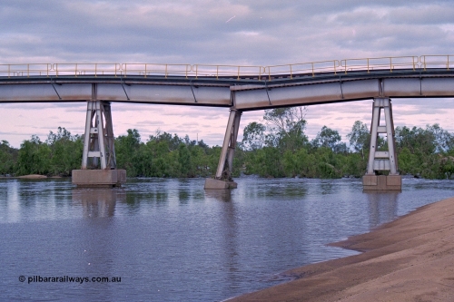 249-08
Yule River bridge looking east upstream the third pier from the southern end was undermined by flood waters from Tropical Cyclone John in December 1999. The rail line was closed for two weeks while repairs were effected. Approximate [url=https://goo.gl/maps/phCWr8u1xnuBdzwj6]location[/url].

