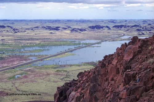 249-17
Table Hill on the Robe River railway line, looking in a northerly direction as the railway line snakes north and heads through Lockyer Gap towards Cape Lambert. Following a very wet 1999 cyclone season Lake Poongkaliyarra is very full. Approximate [url=https://goo.gl/maps/KVjEPms558wdoi2o8]location[/url].
