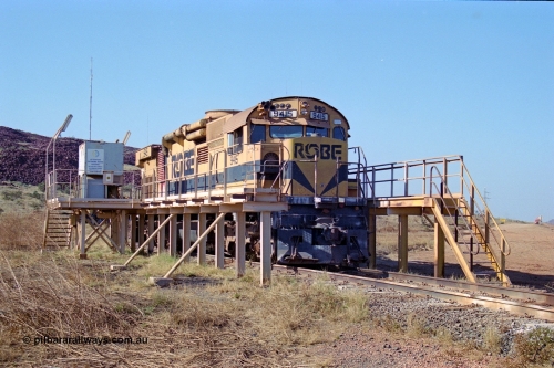 250-31
Cape Lambert yard in the Load Box is recently stored Robe River AE Goodwin built ALCo M636 unit 9415 serial G6060-6 from February 1973 and was an extension of the original order and delivered with cab side numbering of 86-14-1715 and number boards as 1715. The ducting on the hood is the air to air intercooler modifications. 22nd October 2000.
Keywords: 9415;AE-Goodwin;MLW-ALCo;M636;G6060-6;