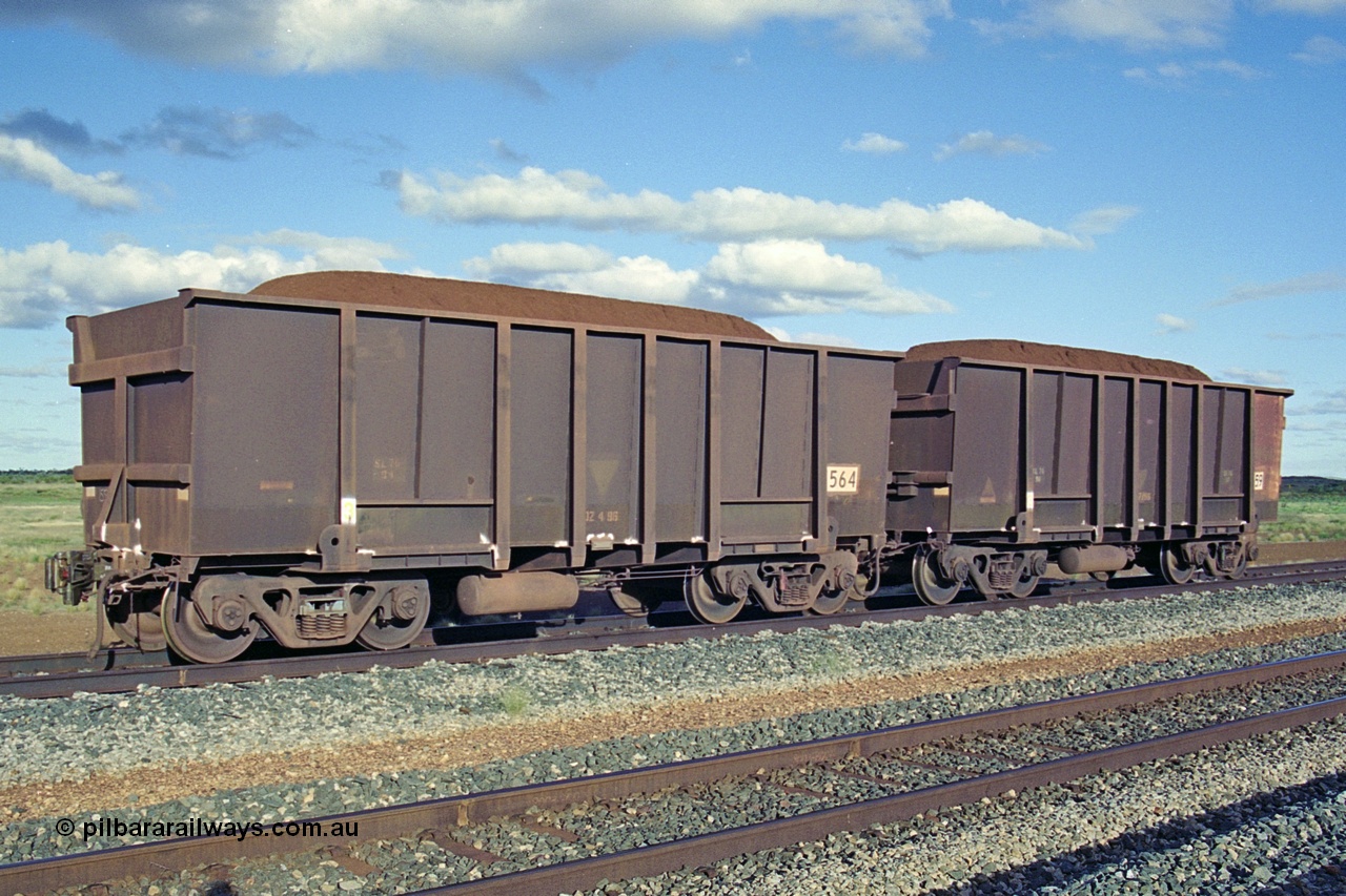 251-35
Walla Siding, two examples of BHP's ore waggon fleet of Comeng built waggons. The waggon closet to the camera has a new coupler fitted.
