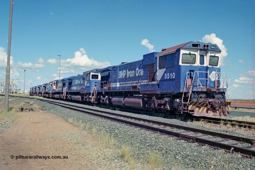 251-00
Nelson Point, BHP's retired Goninan WA's ALCo C636 to GE C36-7M rebuilds, these were the first time in the world that an ALCo C636 had been rebuilt into an GE C36-7, are lined up near the service shop awaiting their fate. The line is 5510, 5506, 5508, 5512, 5513, 5507, 5509, 5511, and, 5513. They had recently been displaced due to the arrival of the AC6000 units which also took their name plates. Only two units would go on to survive 5507 and 5508. 22nd April 2000.
Keywords: 5510;Goninan;GE;C36-7M;4839-07/87-075;rebuild;AE-Goodwin;ALCO;C636;5458;G6027-2;