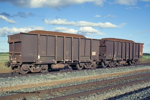 251-35
Walla Siding, two examples of BHP's ore waggon fleet of Comeng built waggons. The waggon closet to the camera has a new coupler fitted.
