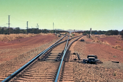 252-17
Rosella Junction looking south at the 251 km. The line to the left goes to Marandoo and Yandicoogina, the straight to Tom Price and Paraburdoo and the right heads to Brockman. Location is roughly [url=https://goo.gl/maps/q3opSy2bPxpd8nv79]here[/url]. 24th November 2001.
