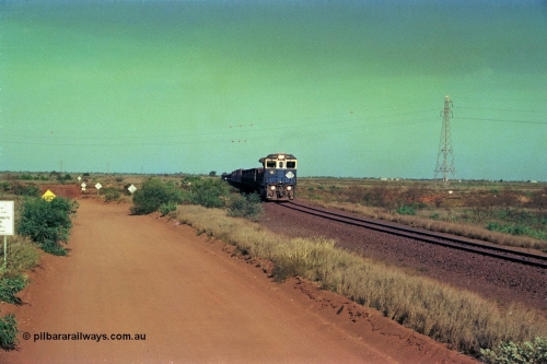 252-31
Port Hedland at 12 Mile Creek a loaded Yarrie train crosses over the creek behind Goninan CM40-8M GE rebuild unit 5645 'Sherlock' serial number 8281-11 / 92-134. Early December 2001.
Keywords: 5645;Goninan;GE;CM40-8M;8281-11/92-134;rebuild;AE-Goodwin;ALCo;M636C;5475;G6047-7;