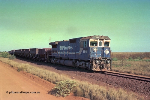 252-33
Port Hedland at 12 Mile Creek a loaded Yarrie train crosses over the creek behind Goninan CM40-8M GE rebuild unit 5645 'Sherlock' serial number 8281-11 / 92-134. Early December 2001.
Keywords: 5645;Goninan;GE;CM40-8M;8281-11/92-134;rebuild;AE-Goodwin;ALCo;M636C;5475;G6047-7;