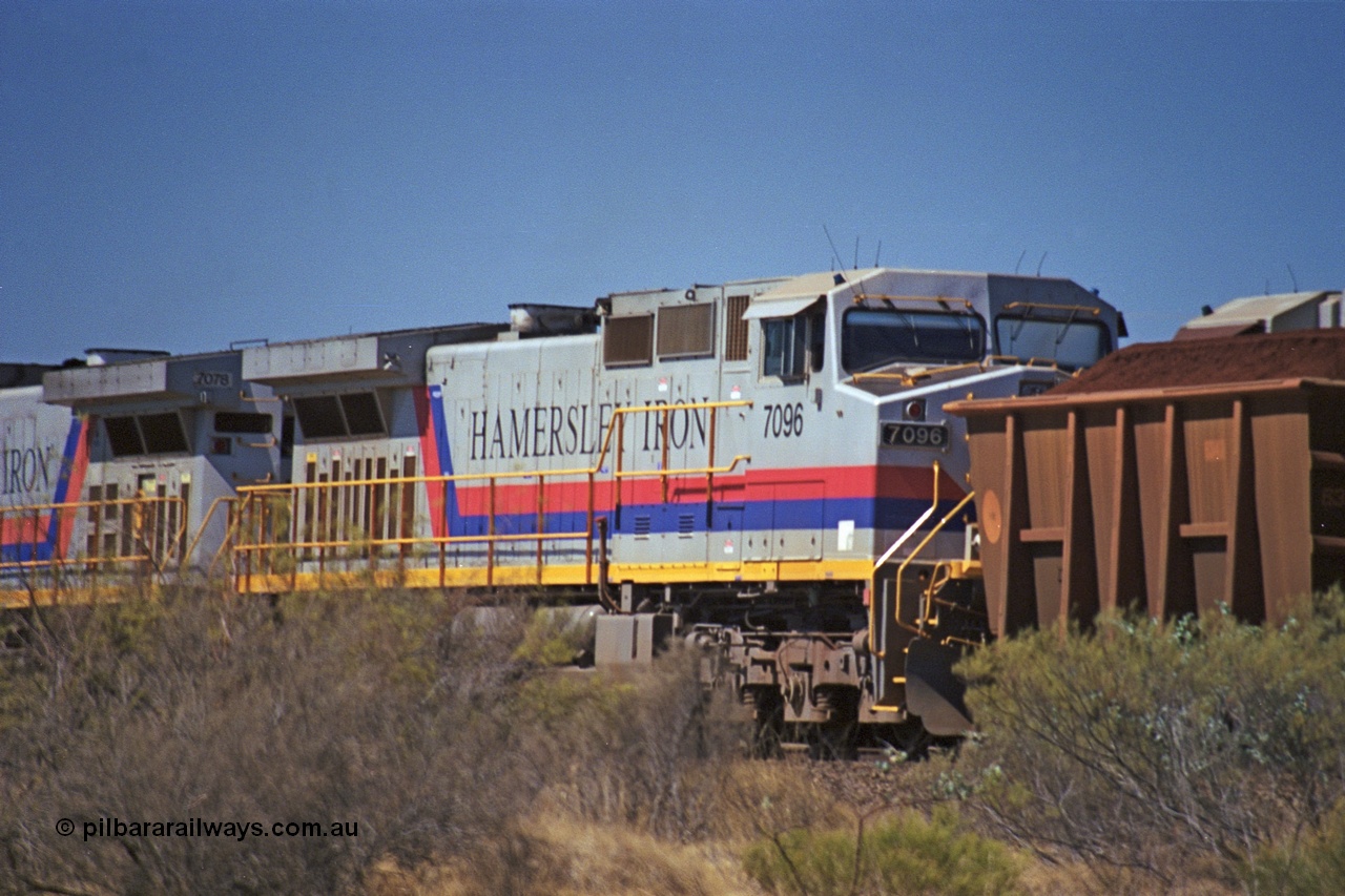 253-06
Dugite near the 64 km on the Dampier - Tom Price railway, second unit on a loaded Hamersley Iron train General Electric 9-44CW unit 7096 from the second order of locomotives with serial number 52843.
Keywords: 7096;GE;Dash-9-44CW;52843;