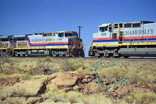 253-04
Dugite near the 64 km on the Dampier - Tom Price railway, as an empty Hamersley Iron ore train sits in the passing track behind General Electric 9-44CW unit 7066 with serial number 47745 as a loaded rolls by on the mainline behind sister 9-44CW unit 7078 serial number 47757. Both of these units are from the original order and built in October 1994.
Keywords: 7066;GE;Dash-9-44CW;47745;