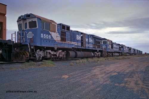 254-16
Flash Butt yard, stored line-up of the eight Goninan ALCo to GE rebuild C36-7M units, 5506 with serial number 4839-01 / 87-071. This was the first unit in the world to be built into a C36-7 from an ALCo C636 locomotive. It was rebuilt 1987 from AE-Goodwin built ALCo C636 numbered 5455 with serial number G6012-4.
Keywords: 5506;Goninan;GE;C36-7M;4839-01/87-071;rebuild;AE-Goodwin;ALCo;C636;5455;G6012-4;