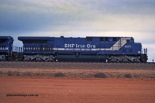 254-20
Bing Siding, an empty train awaits departure time behind 6071 an General Electric built AC6000 model with serial number 51063. The locomotive has not yet been named. Side view. September 2001.
Keywords: 6071;GE;AC6000;51063;