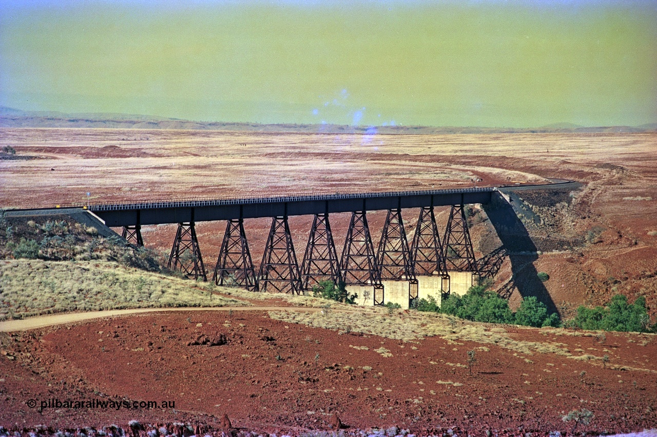 255-01
Fortescue River bridge on the Robe River Cape Lambert to Deepdale line at the 115.8 km looking south. Geodata [url=https://goo.gl/maps/FESXZ7bkPCQmeWhZ8]location here[/url]. May 2002.
